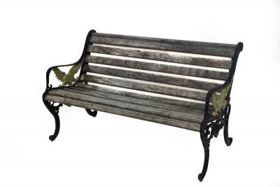 Appraisal: A slatted garden bench the iron end supports decorated with