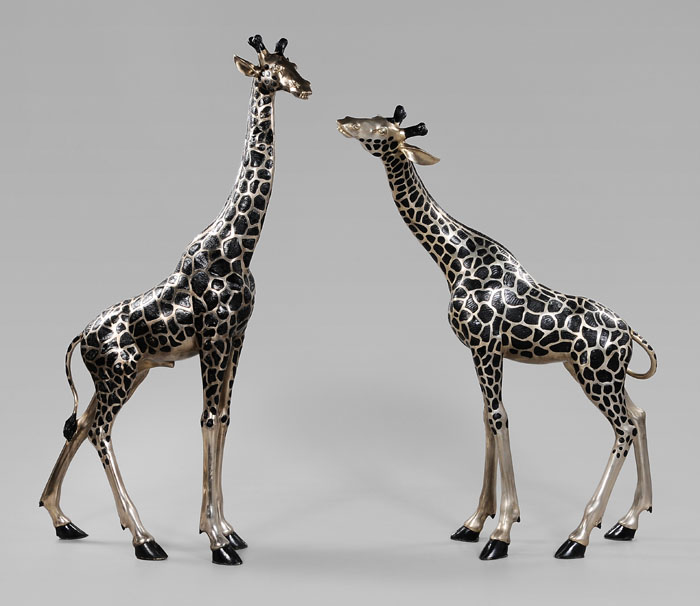 Appraisal: Pair Cast Metal Giraffes modern brass or mixed alloy with