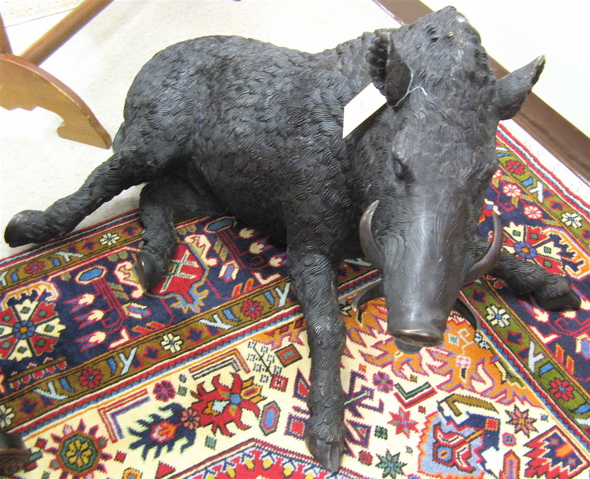 Appraisal: LIFE-SIZE BRONZE WILDLIFE SCULPTURE a recumbent African Warthog Dimensions H