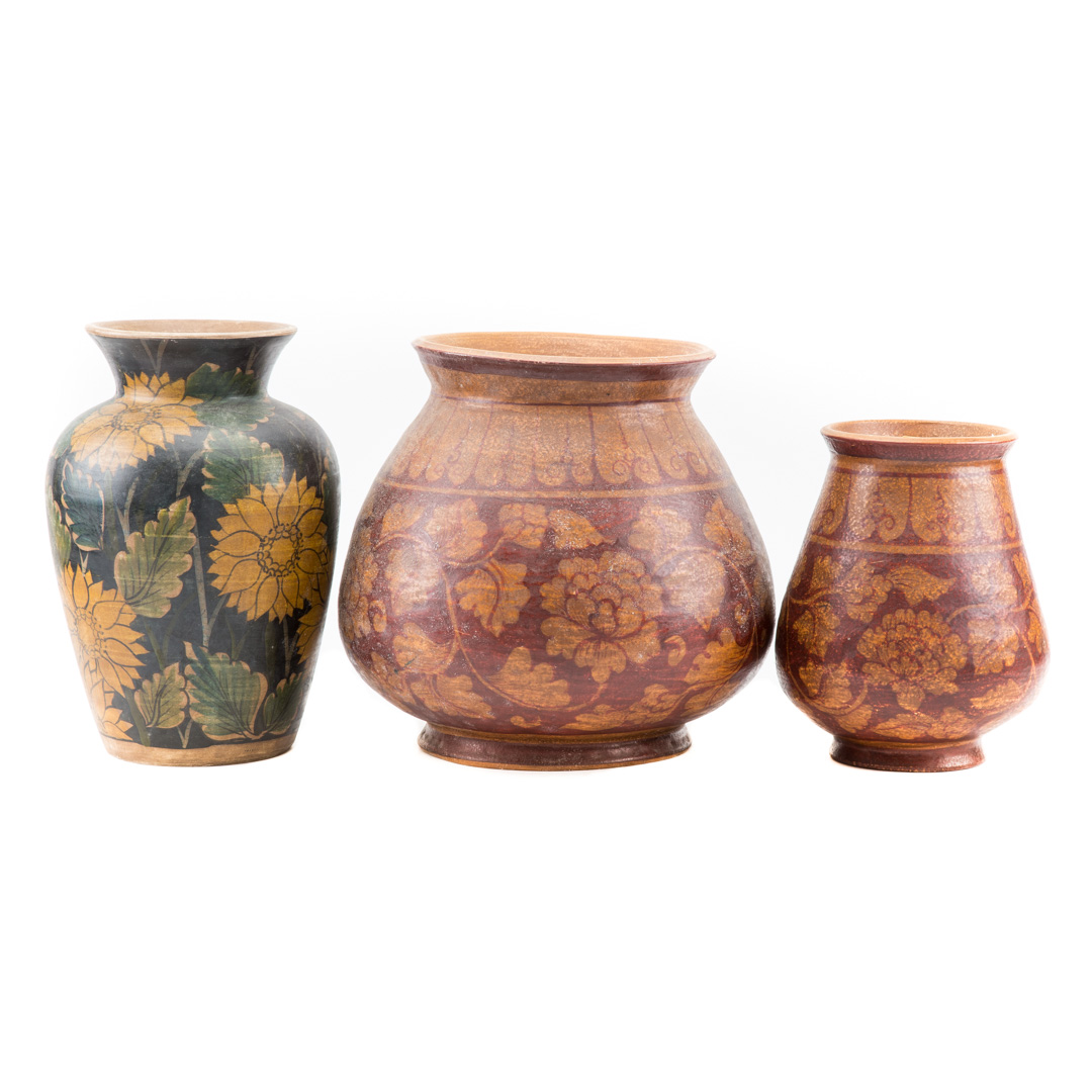 Appraisal: Three painted ceramic vases with stylized floral decoration in H