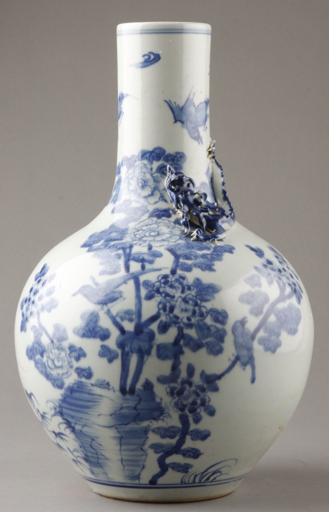 Appraisal: Vase features white ground with blue floral and bird motif