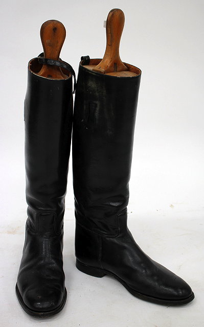 Appraisal: A PAIR OF GENTS BLACK LEATHER RIDING BOOTS and wooden