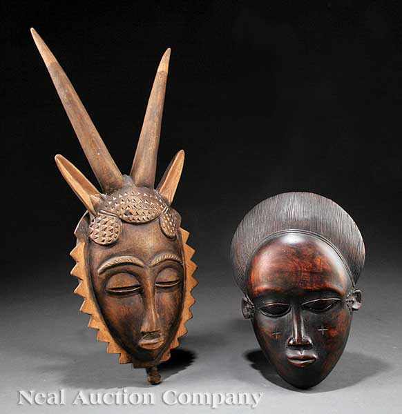 Appraisal: Two African Carved Wood Masks the first with long horns