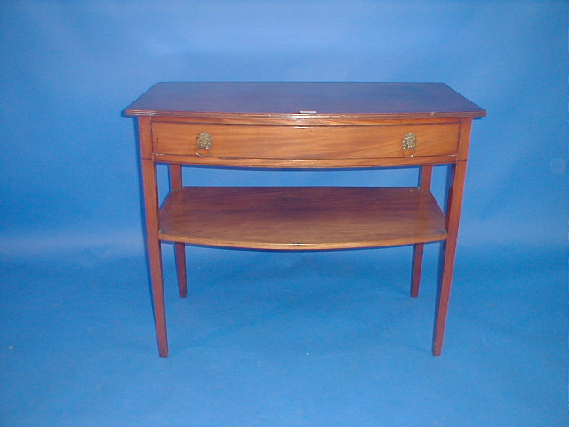 Appraisal: A thC mahogany bow front side table with reeded top