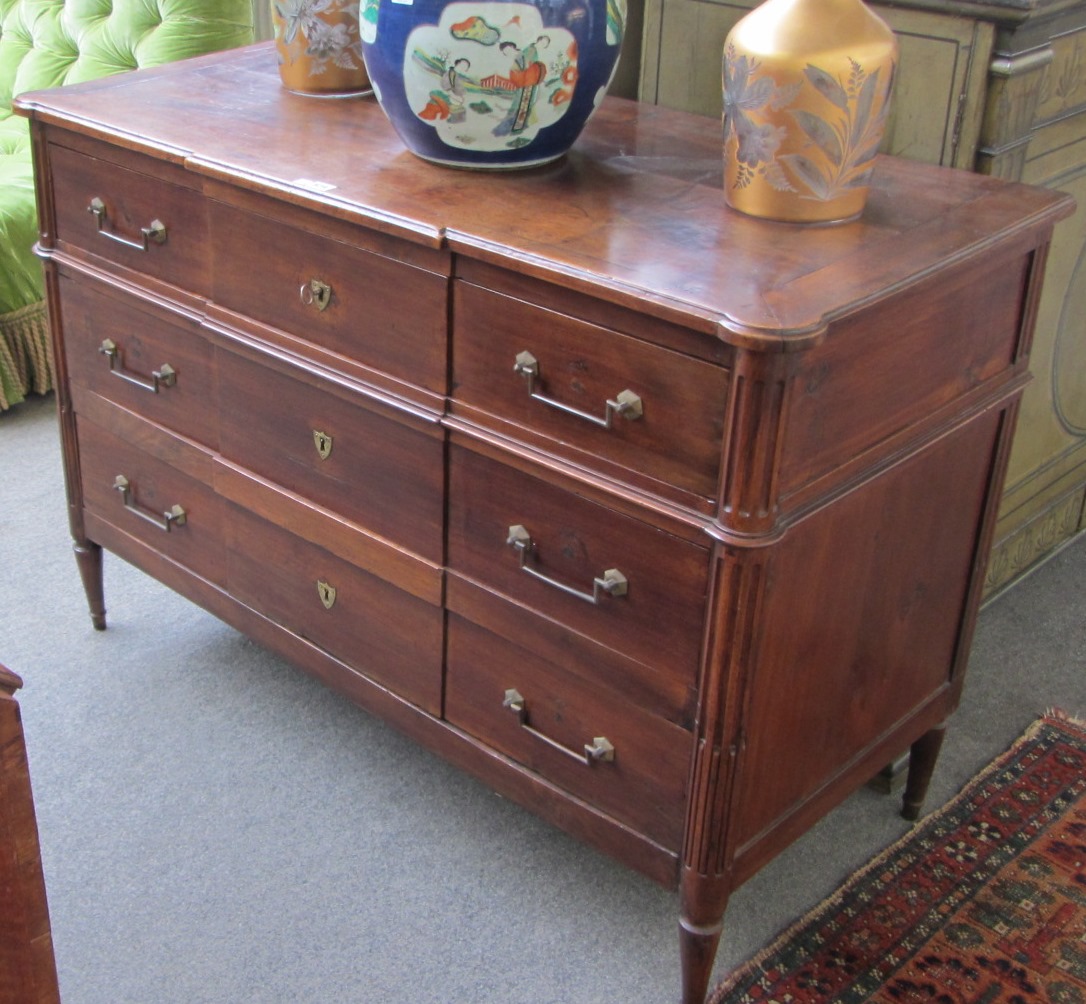 Appraisal: An th century French walnut commode with three long breakfront