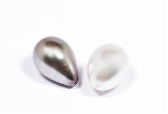 Appraisal: TWO PEARLS Two loose drilled drop-shaped South Sea cultured pearls