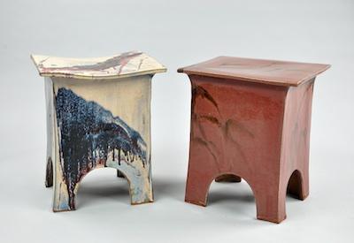 Appraisal: A Pair of Glazed Ceramic Stools In matching shapes decorated