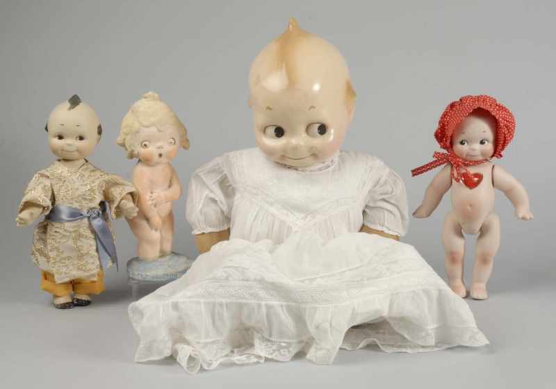 Appraisal: Lot of Kewpies and Grace Drayton Figure Description Rare compo