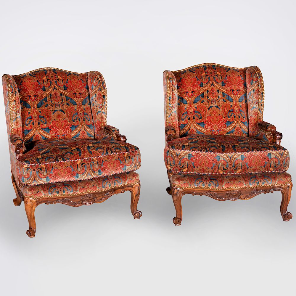 Appraisal: Pair of R gence Style Winged Berg res Each upholstered