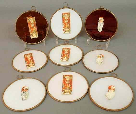 Appraisal: Set of nine round German glass Christmas archway ornaments seven