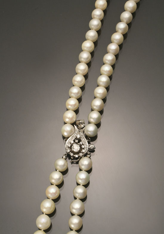 Appraisal: Matinee Length Cultured Pearl and Diamond Necklace Knotted The double