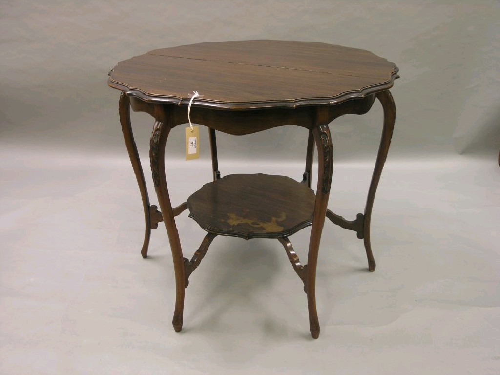 Appraisal: An Edwardian mahogany centre table lobed circular top upon six