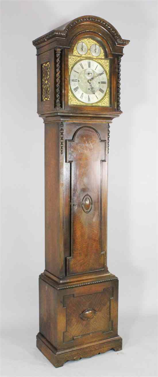 Appraisal: An early th century Jacobean revival oak eight day chiming