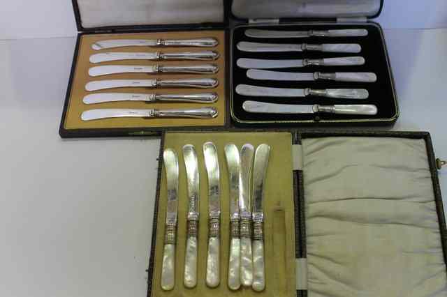 Appraisal: TWO SETS OF SILVER PLATED MOTHER-OF-PEARL HANDLED FRUIT KNIVES together