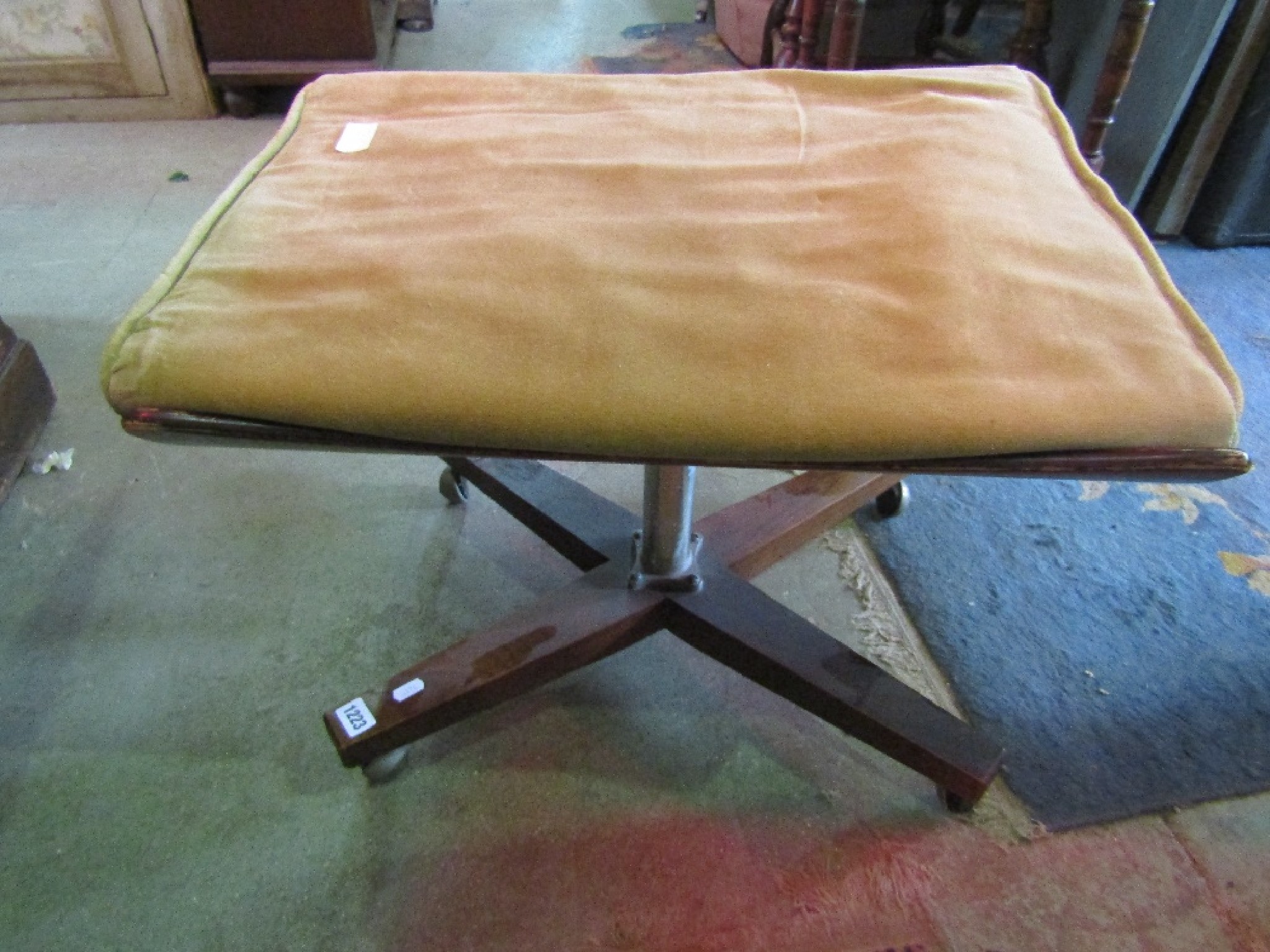 Appraisal: A mid th century teak stool the dished rectangular seat