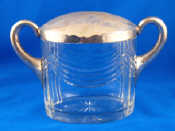 Appraisal: A continental silver standard mounted cut glass two handled oval