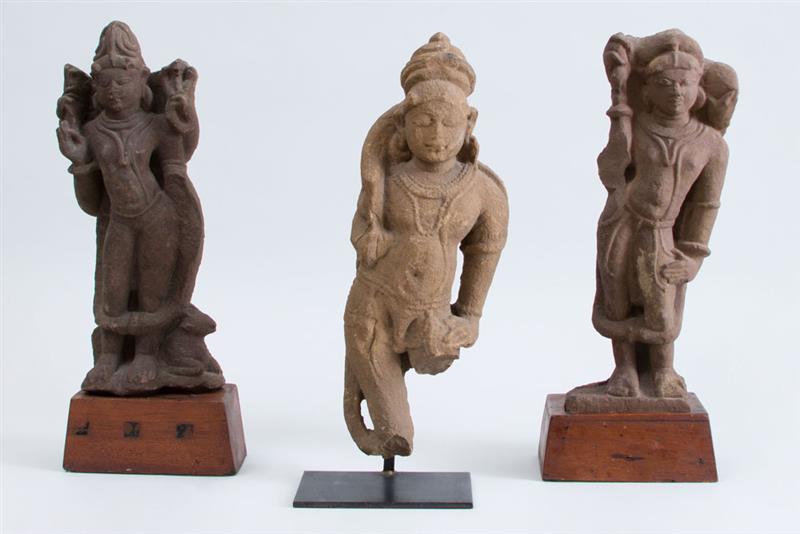 Appraisal: GROUP OF THREE CENTRAL INDIAN CARVED SANDSTONE FIGURES OF DEITIES