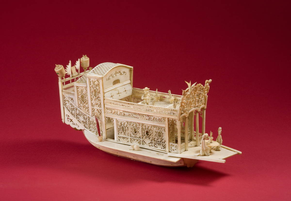 Appraisal: IVORY FLOWER BOAT WITH DETAILED CARVING OF FIGURES AND ARCHITECTURAL