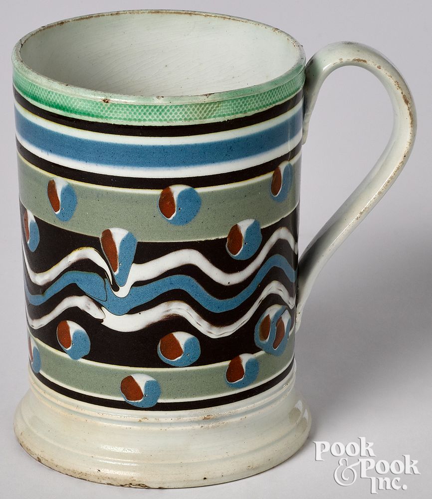 Appraisal: Mocha mug Mocha mug with cat's-eye and wavy line decoration