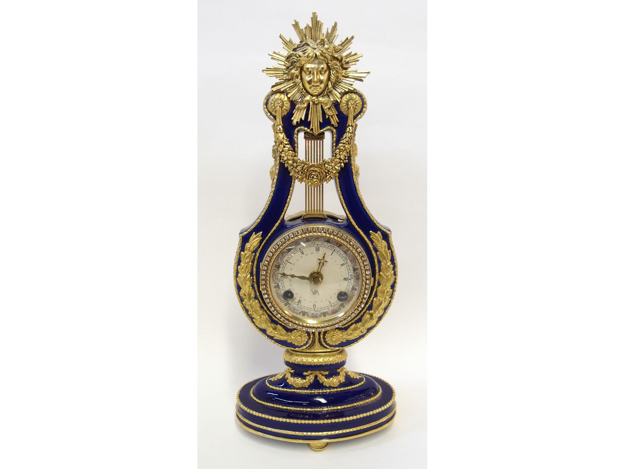 Appraisal: French Empire-style enamelled and gilt metal mounted clock