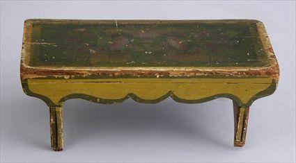 Appraisal: AMERICAN GREEN AND OCHRE PAINTED PINE MINIATURE BENCH The overhanging