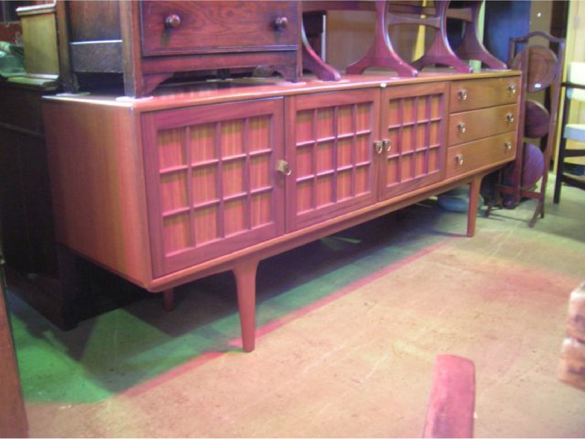 Appraisal: A long and low mid th century sideboard by Younger