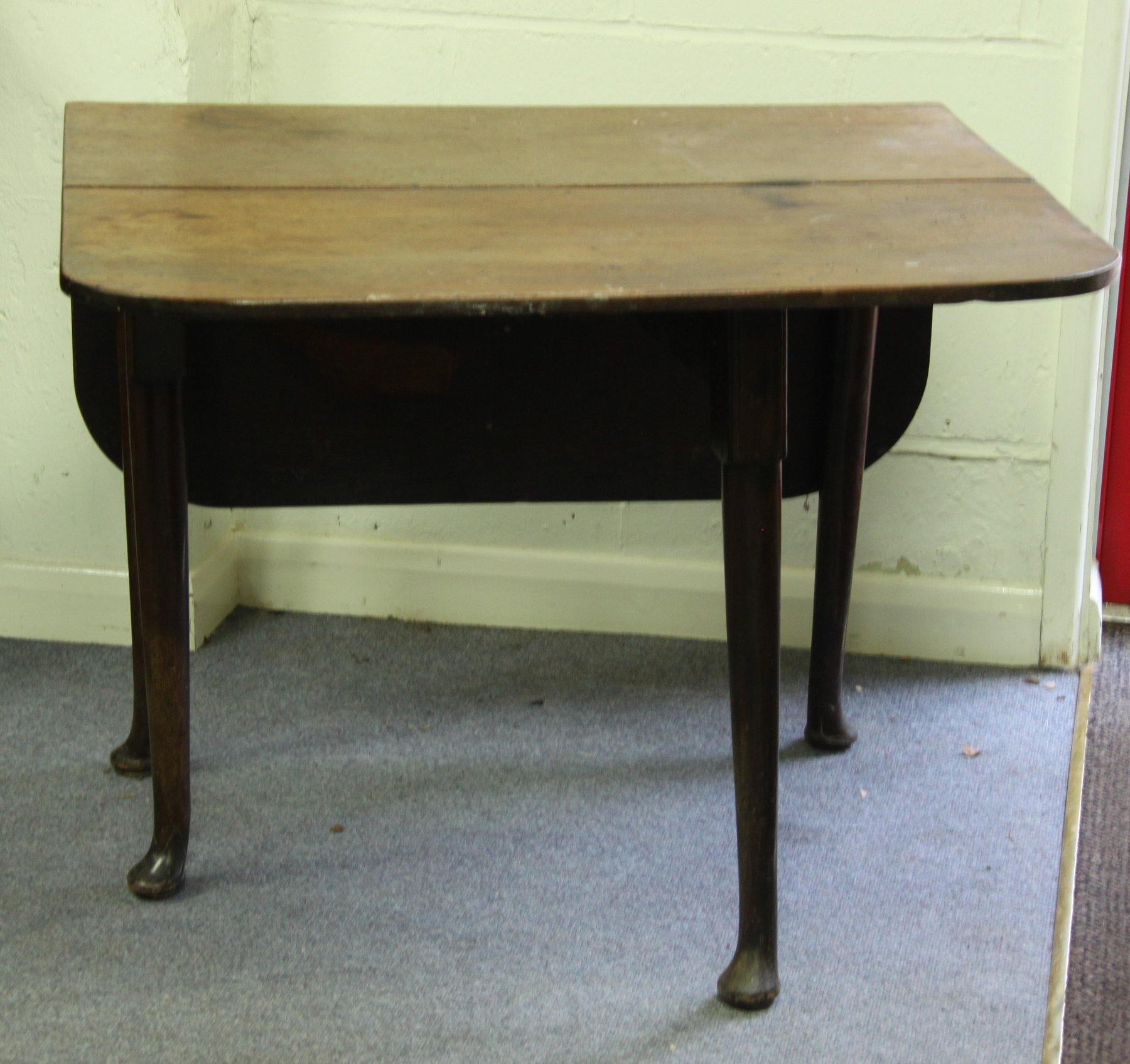 Appraisal: A late th Century mahogany two-flap table on turned legs