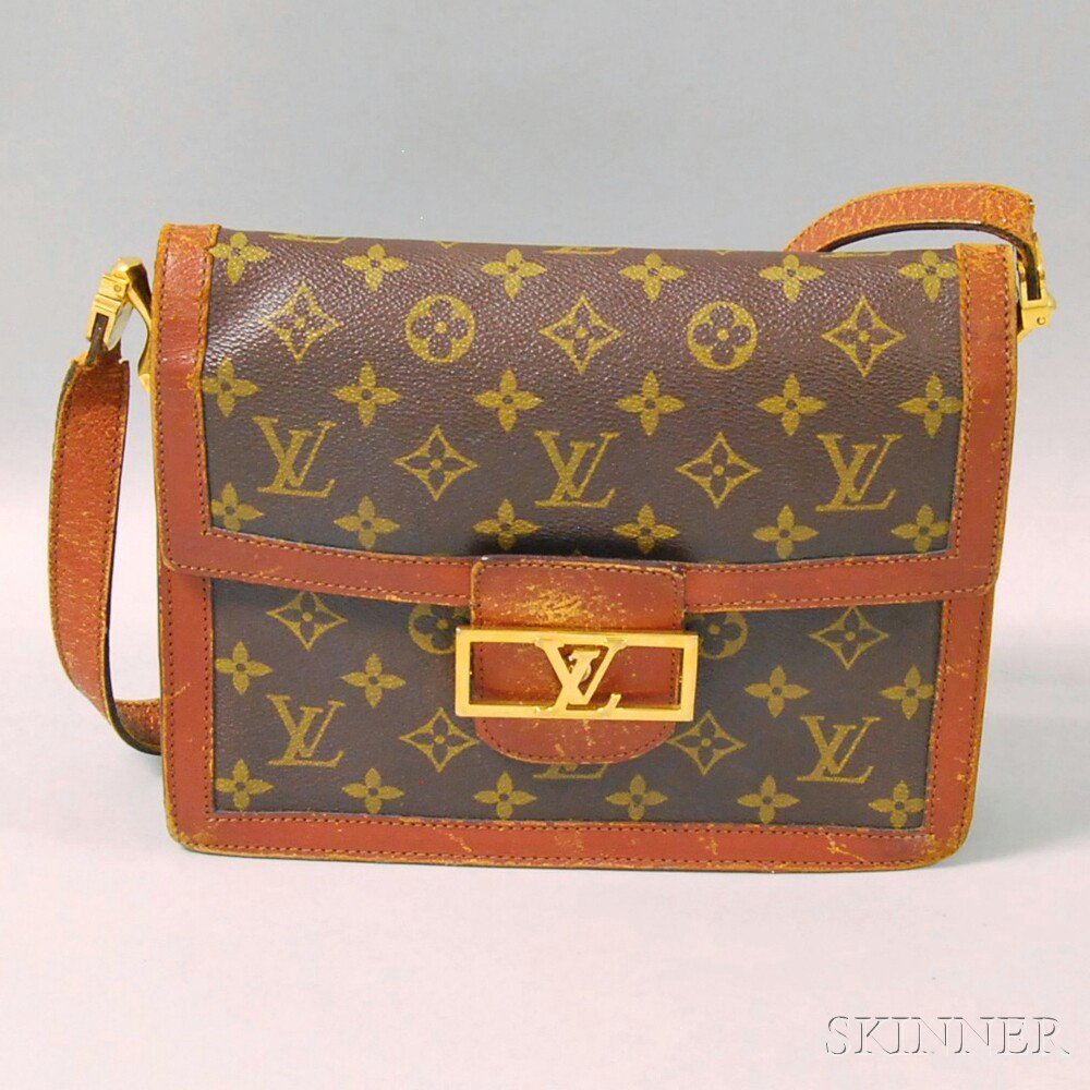 Appraisal: Louis Vuitton Monogrammed Leather Purse with gold-tone LV front buckle