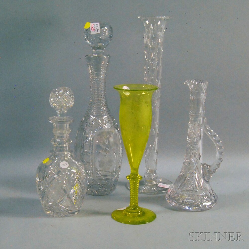 Appraisal: Five Cut Glass Vessels a yellow grapevine-etched vase with swirled