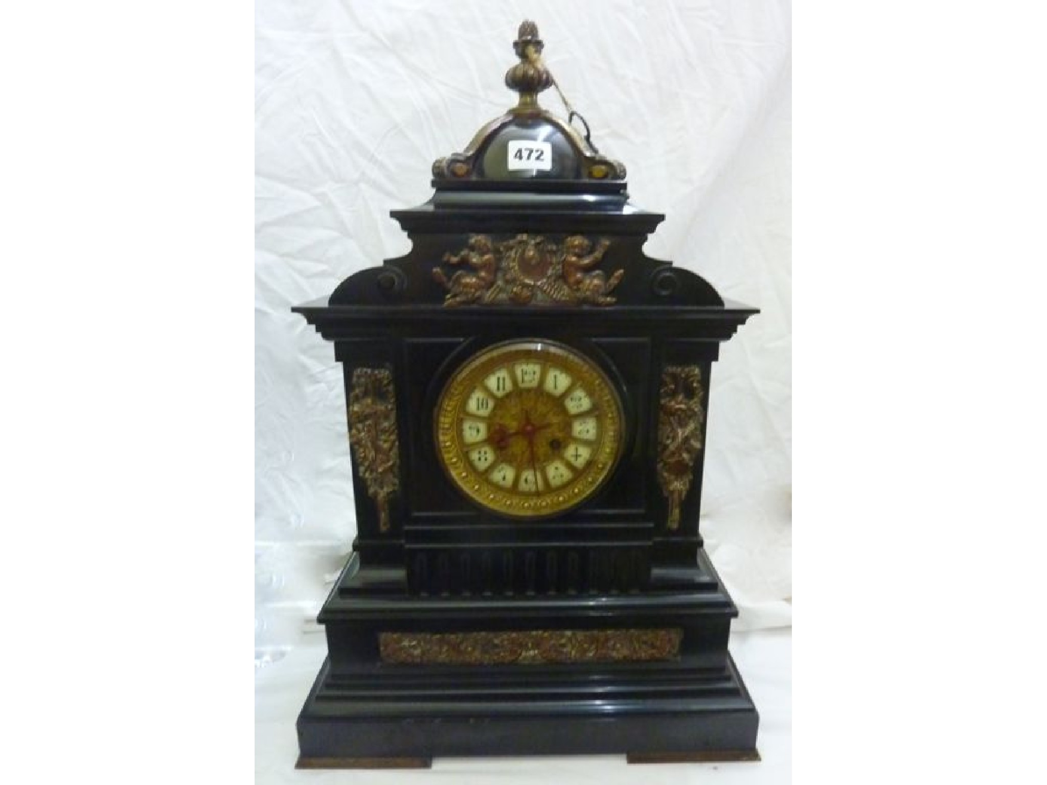 Appraisal: A substantial Victorian black slate mantel clock with applied brass