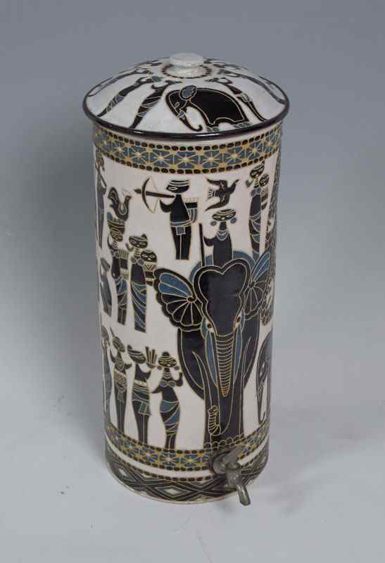 Appraisal: EUROPEAN ELEPHANT DECORATED POTTERY WATER COOLER Incised African motif with