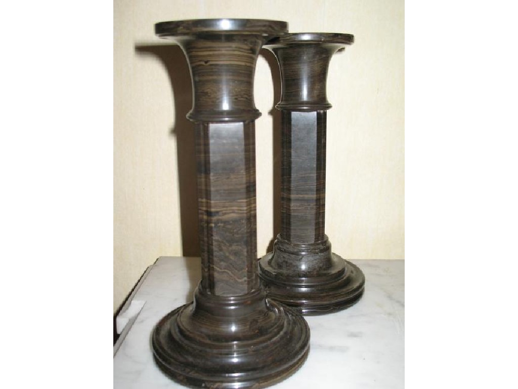 Appraisal: A PAIR OF SERPENTINE CANDLESTICKS in finely striated stone with