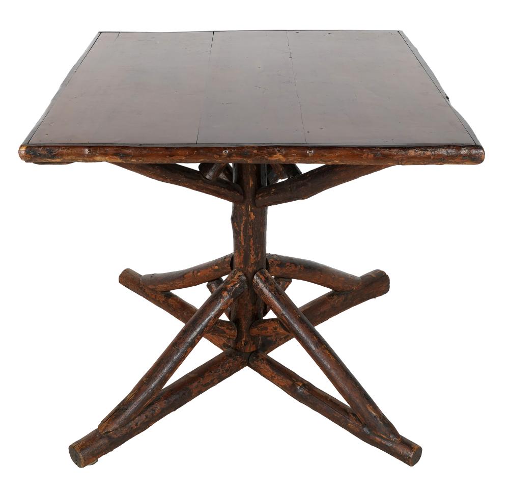 Appraisal: RUSTIC WOOD GAME TABLEthe top on a tree branch base