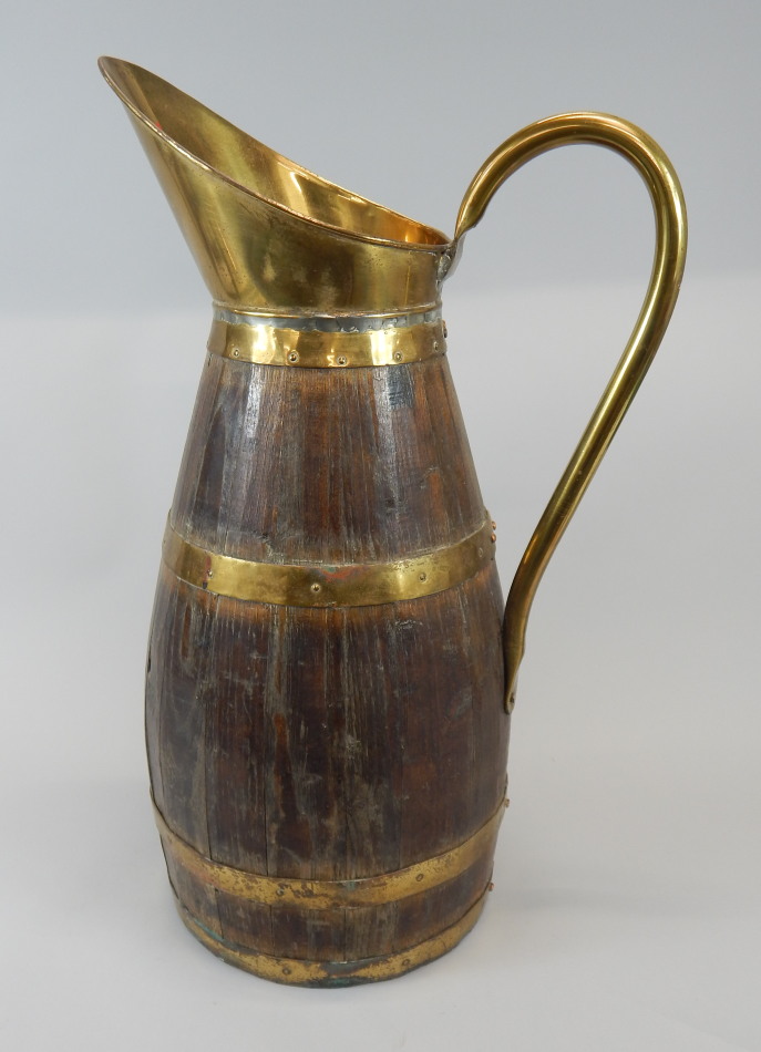 Appraisal: A late th early thC oak and brass coopered jug