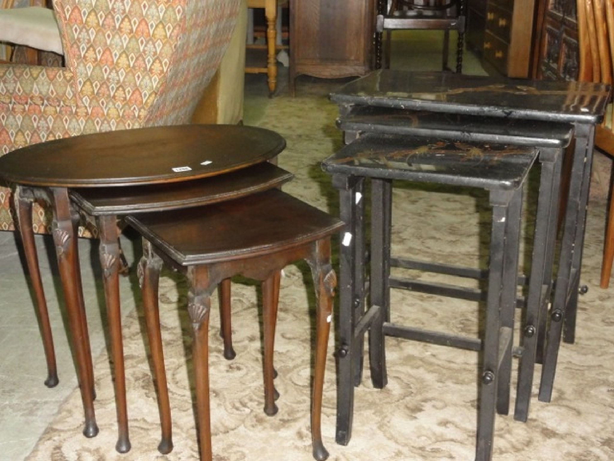 Appraisal: A nest of three Georgian style walnut occasional tables the