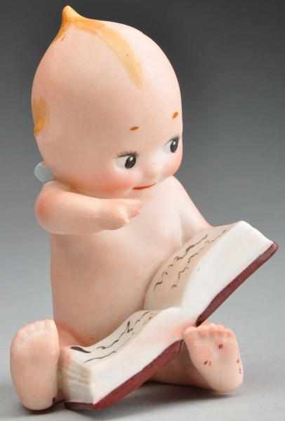 Appraisal: Kewpie Reading Book Description All bisque Rose O Neill design