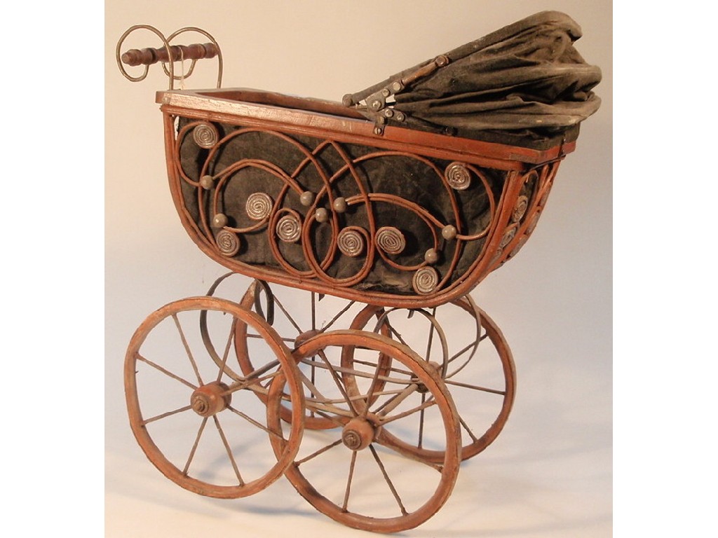 Appraisal: An Edwardian style doll's pram with wooden framing wider side