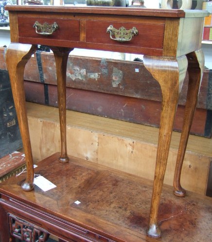 Appraisal: A th century mahogany and beech side table with a