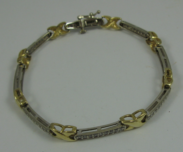 Appraisal: DIAMOND AND K YELLOW AND WHITE GOLD BRACELET in length