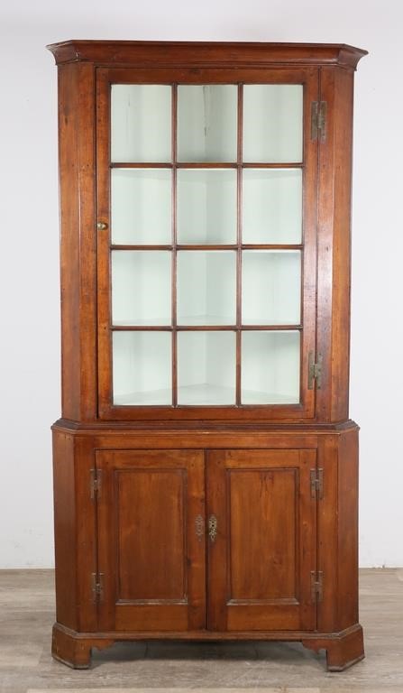 Appraisal: th century American corner cabinet Glazed doors three fixed shelves