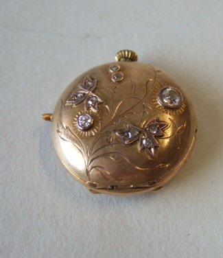 Appraisal: A ladies gold cased and diamond set hunting cased fob