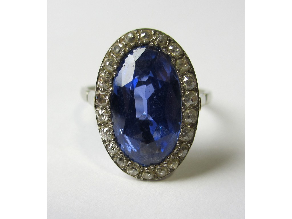 Appraisal: A white metal Ceylon sapphire and diamond cluster ring with