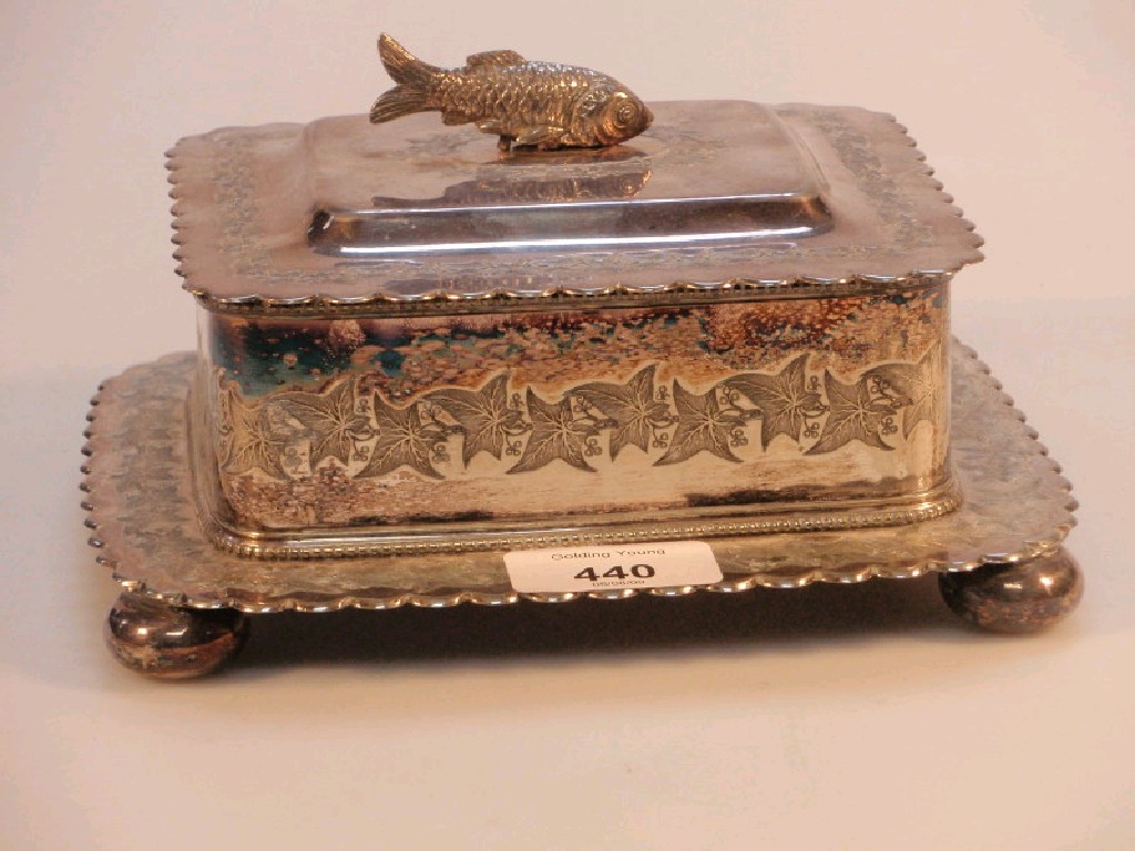 Appraisal: An electroplate fish serving box on ball feet the cover