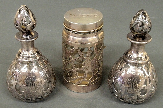 Appraisal: - Two silver overlay bottles with stoppers and a covered