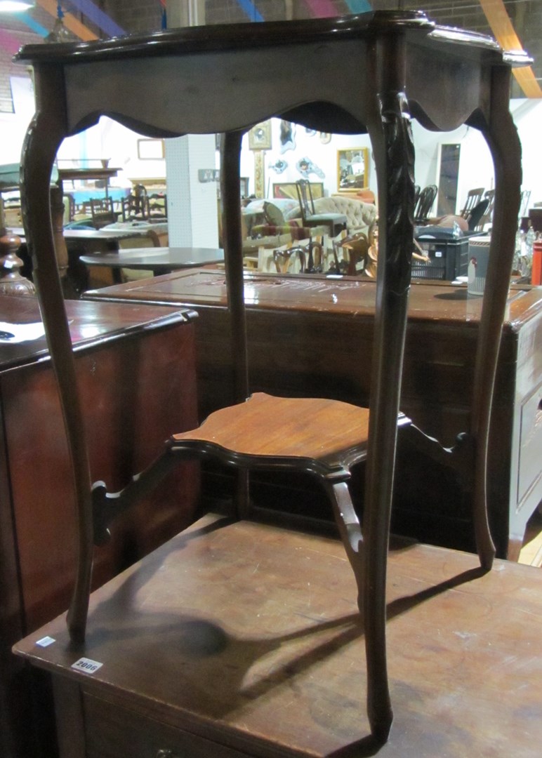 Appraisal: A mahogany two tier occasional table