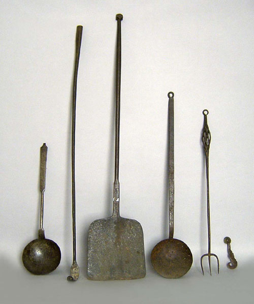 Appraisal: Wrought iron tools to include a jagging wheel peel skimmer