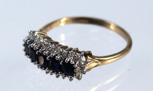 Appraisal: A cluster ring with blue and white stones each claw