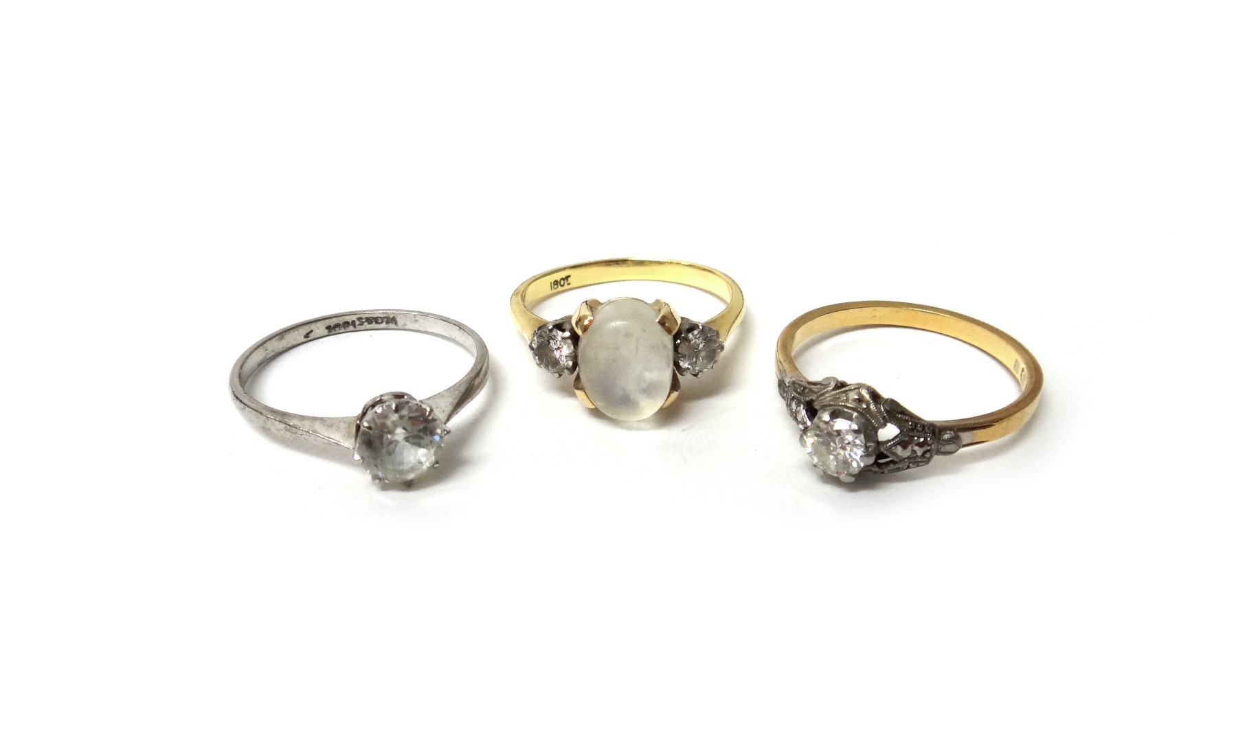 Appraisal: A gold and platinum diamond set single stone ring claw