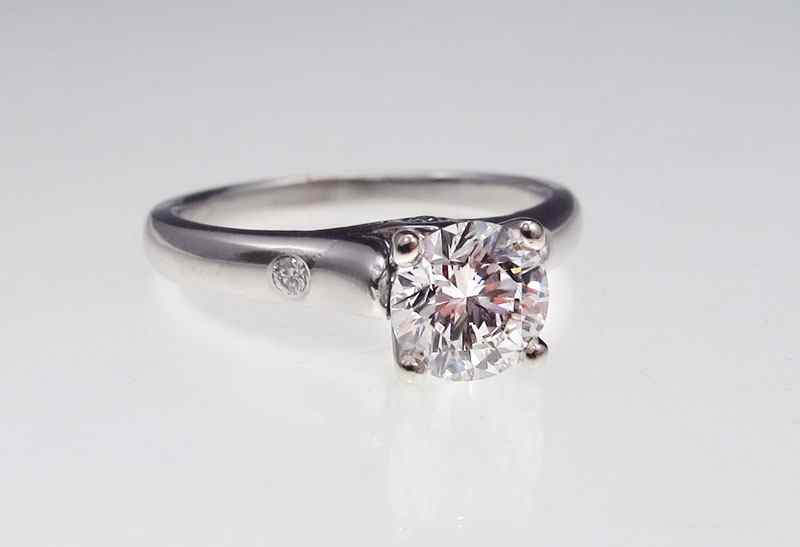 Appraisal: PLATINUM DIAMOND SOLITAIRE Platinum ring centering a Ct round brilliant