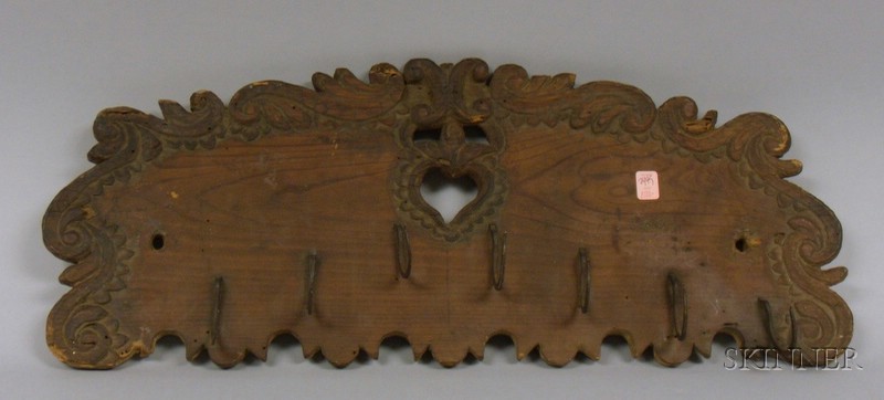 Appraisal: Folk Carved and Heart Cut-out Pine Harness Wall Rack with